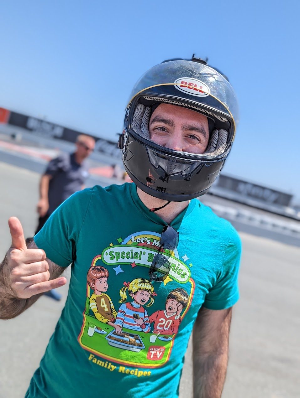 dimo in a racing helmet at a track day